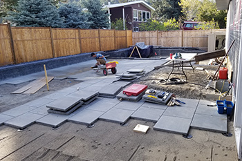 Pool with slide stamped concrete